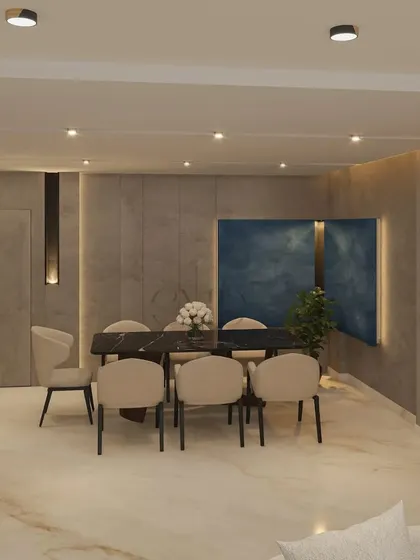 The dining area features a stunning blue textured wall panel, adding a bold yet harmonious touch to the neutral and metallic tones of the space.