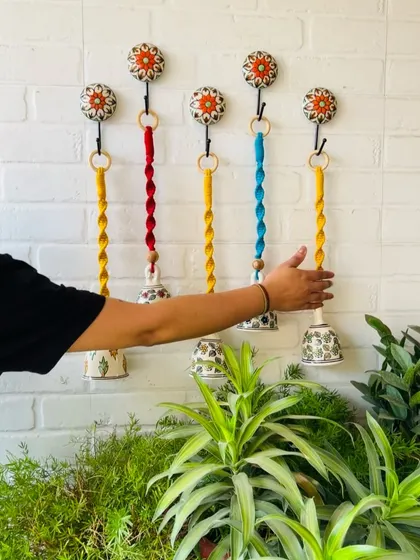 A beautiful set of five macrame ceramic bells in different colors. These are one of our best-selling products, and you can customize the colors to create your own unique set.