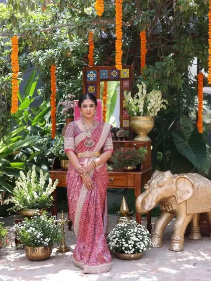 A full view of this stunning pink ensemble. The traditional decor perfectly complements the client's classic and elegant look.