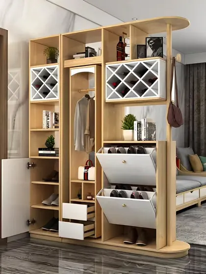 A multi-functional entryway cabinet that serves as a room divider. It includes a shoe rack with tilt-out doors, coat storage, and open shelving for books and decor.