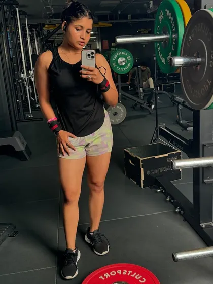 A post-workout check-in. Notice the wrist wraps, which I use for support during heavy lifting to protect my joints and ensure proper form.