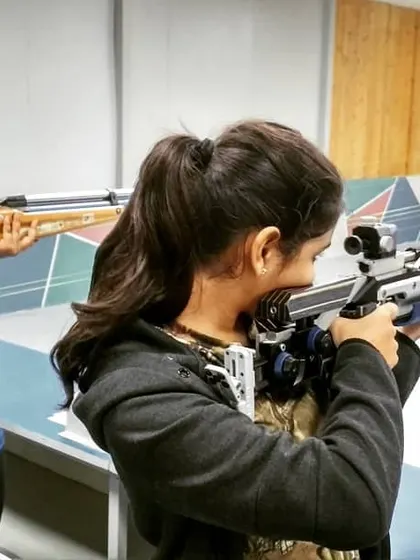 A closer look at our students during rifle practice, showing their focus and the proper handling of the equipment.
