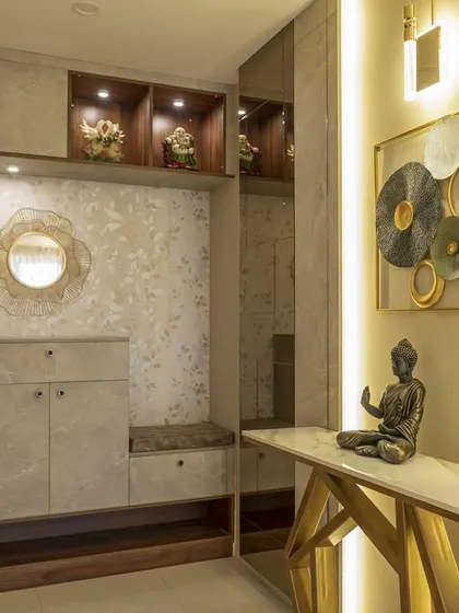This foyer from our Vaswani Menlo Park project welcomes you with earthy tones, a custom storage unit with a seating nook, and a console table highlighted by warm backlighting.