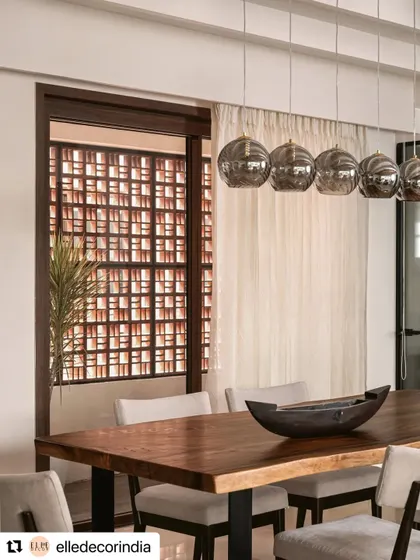 This shot from our Elle Decor feature highlights the dining area with its terracotta jali screen. The design is inspired by California's relaxed spirit, using warm colors to reflect Indianness in a modern way.