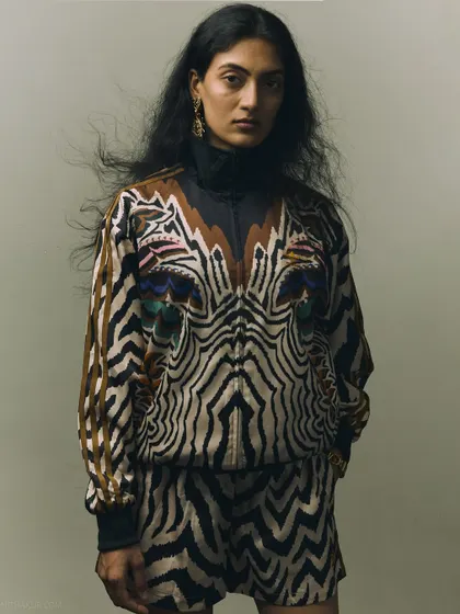 A direct, powerful portrait with a touch of wind in the hair. This adds energy and a raw, untamed quality to the fashion shot.
