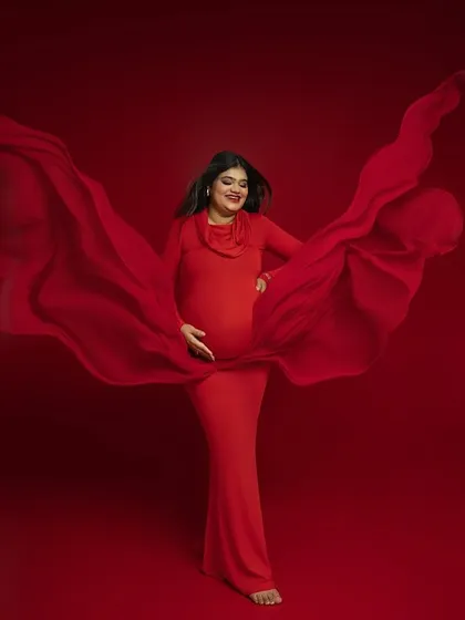 The magic of flowing fabric. I use drapes and movement to add a sense of life and energy to my portraits, turning a simple pose into a dynamic work of art. This shot in a vibrant red gown captures that feeling perfectly.