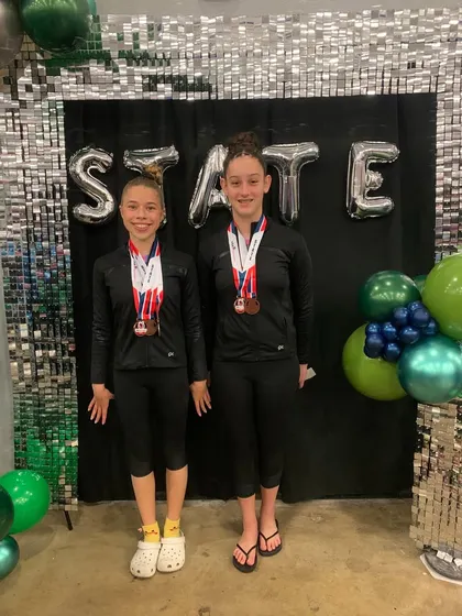 Two more of our amazing Xcel athletes with their well-deserved medals from the State championships.