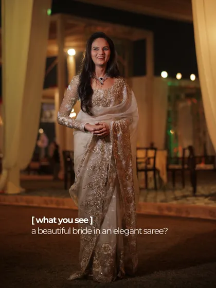 What you see is a beautiful bride in an elegant saree. What we see is a woman who blossomed, finding a new twinkle in her eye.