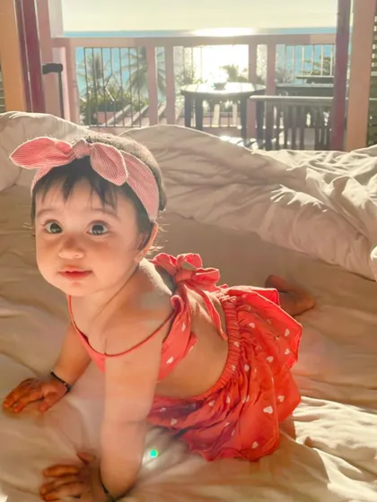 My daughter Aarriya, the heart and soul of the atelier, in a custom heart-print crop top and skirt set. This adorable backless design is perfect for warm, sunny days.