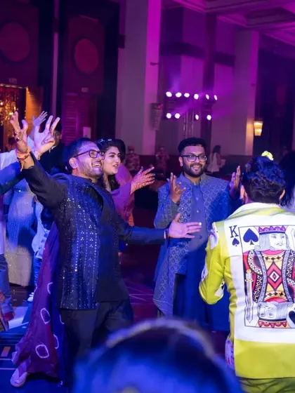Guests dancing with abandon at a sangeet after-party. Our DJs and live bands know exactly how to keep the party going all night long.