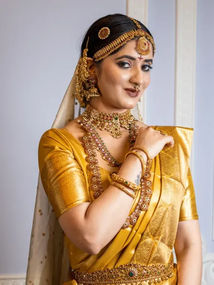 A beautiful smile from a happy bride. This look, created for a class demonstration, shows how to achieve a glamorous yet traditional South Indian bridal style.
