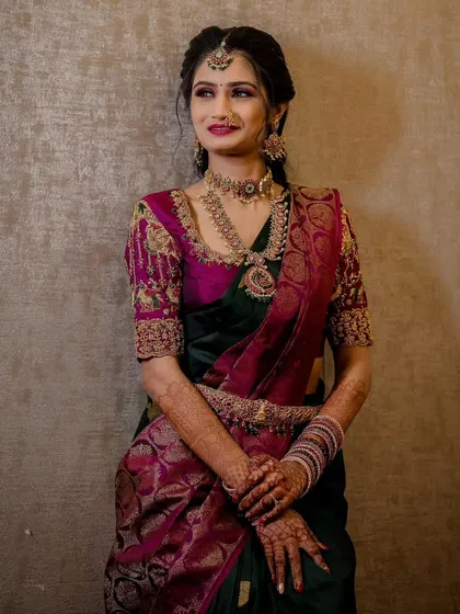 Another one of my beautiful brides. We chose a semi-precious stone set that matched her dark green and magenta saree perfectly for her muhurtham.