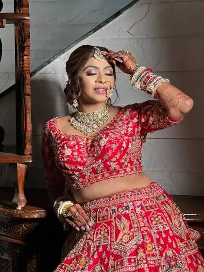 A moment of quiet reflection before the ceremony. The makeup is designed to be picture-perfect from every angle, with a focus on smooth skin and beautifully blended tones that catch the light.
