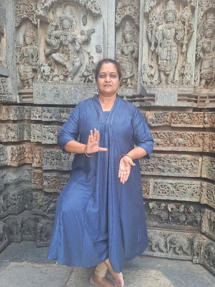 Striking a pose at Somanathapura. These monuments are living textbooks for dancers.