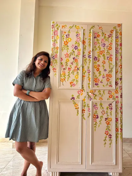 Standing proudly next to the finished floral almirah. This project shows how even a heavy, old metal piece can become a work of art that preserves memories.