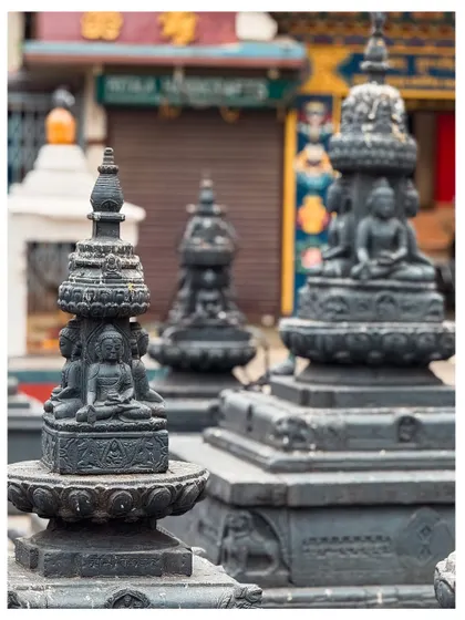 A close-up of miniature Buddhist stupas, showcasing the detailed craftsmanship of religious artifacts.