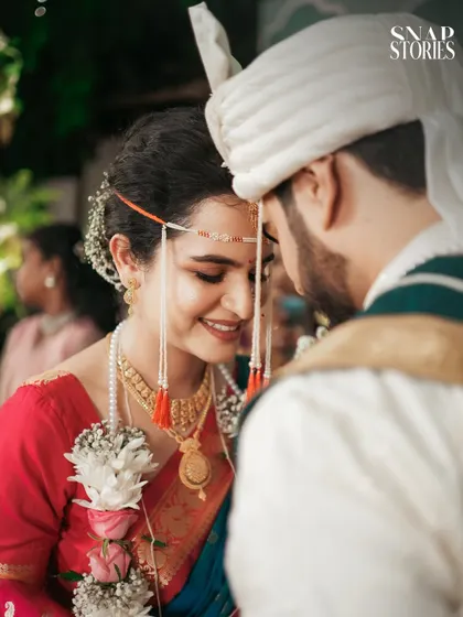 An intimate close-up of the bride and groom, their heads together in a moment of quiet connection. These soft, romantic shots are a beautiful addition to any wedding album.
