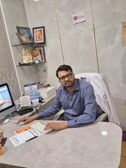 A photo of my colleague, Dr. Manish Jangra, at his desk. Our team is dedicated to providing the highest standard of care.