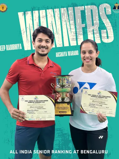 Champions at the All India Ranking Tournament in Bangalore. Deep Rambhiya and Akshaya Warang with their winner's trophy, a result of their remarkable consistency and dedication.