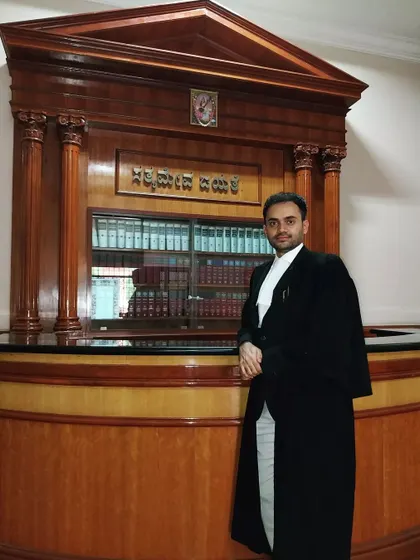 Pictured here at the Karnataka High Court. I am familiar with the workings of various high courts, allowing me to effectively represent clients across different jurisdictions.
