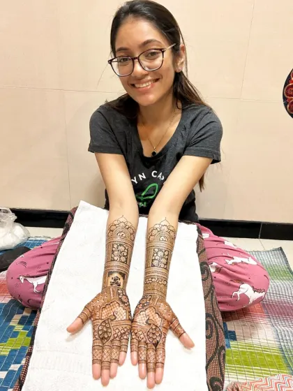 The happy client with her beautiful bridal mehndi. Seeing this smile is the best part of my job.