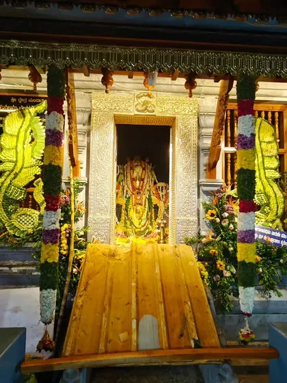 The beautifully decorated sanctum of the temple in Mangalore, where the main deity is in front of an anthill.