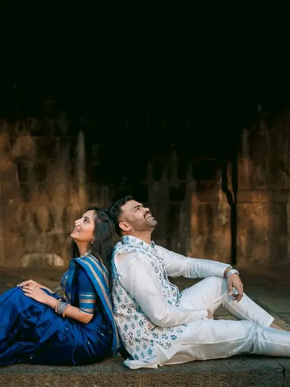 Looking up towards a shared future. This creative shot of Ankush and Aishwarya at their pre-wedding shoot uses the architecture to draw the eye and tell a story of hope and togetherness.