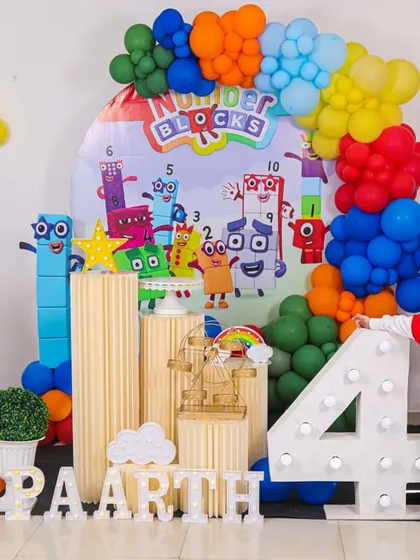 A thrilling 'Avengers' themed birthday party, with superhero cutouts, a cityscape backdrop, and dynamic balloon arrangements, ready for action.