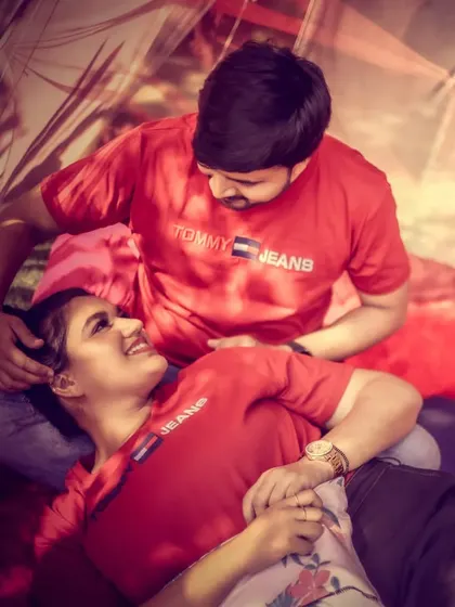 A tender moment from a pre-wedding shoot, capturing the couple's close bond in a relaxed, romantic setting.