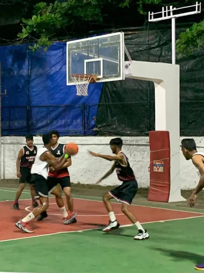 A player drives to the basket, navigating through defenders. This shows the confidence and skill we build in our practice games.