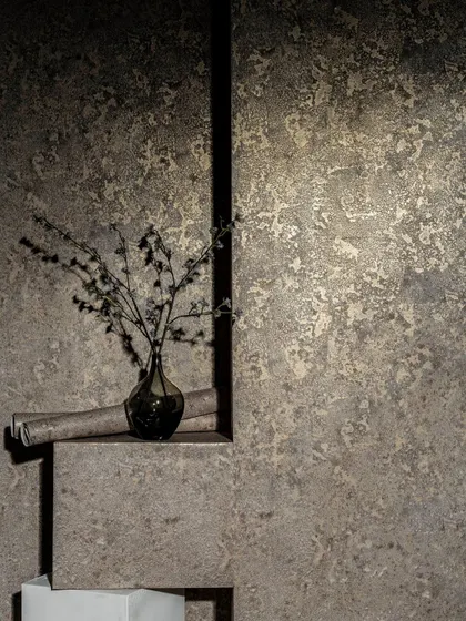 This wallpaper has a rich, weathered texture that mimics old plaster or concrete. It's perfect for creating an industrial or wabi-sabi aesthetic with a lot of depth and character.