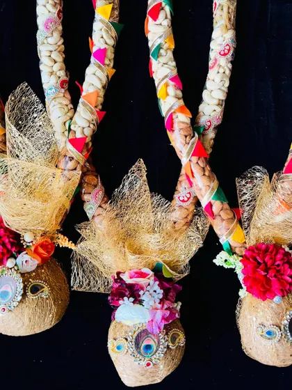 These unique Holi garlands are made with decorated coconuts and tubes of mixed nuts. They are a traditional yet creative gift, perfect for festive greetings and home decor.