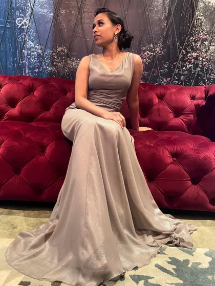 Chic and refined, this draped beige gown is designed for unforgettable moments. The soft, flowing fabric and elegant cowl neck create a look of understated sophistication.