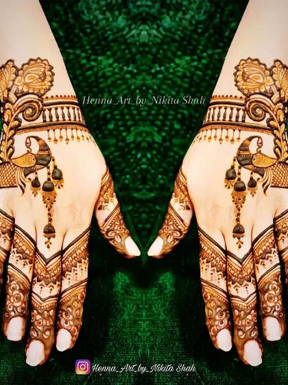 A chic and stylish back-hand design. The peacock motif is designed in a modern, flowing style that is very popular.