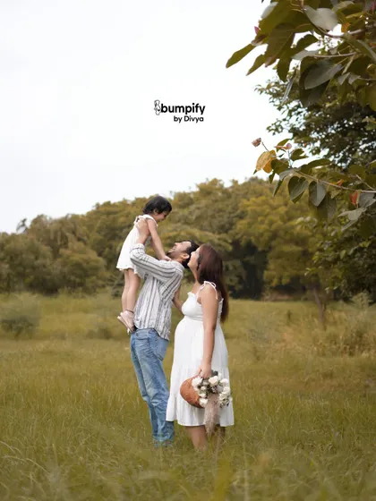 Lifting his daughter up to the sky. This playful and loving moment is a perfect example of the candid, joyful images we can create during an outdoor family session.