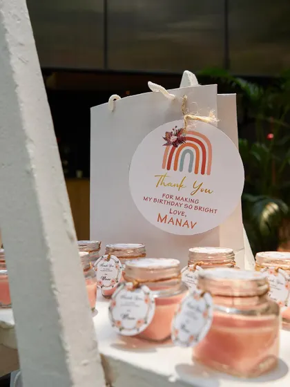A close-up of the personalized party favors. These small, thoughtful details, like custom tags and packaging, show guests how much they are appreciated and complete the event's theme.