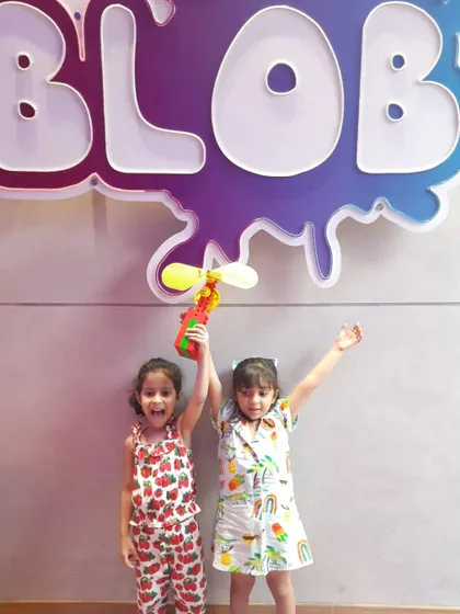 A duplicate of ID 214, showing two happy campers with their creation at Blob studio.