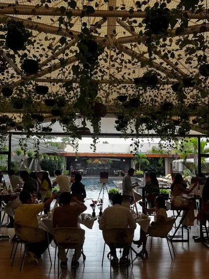 A beautiful poolside view of the engagement party setup. The serene location provided the perfect backdrop for a relaxed and creative celebration.