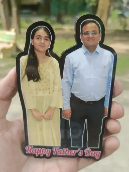 A cutout fridge magnet for Father's Day, featuring a photo of a father and daughter with a 'Happy Father's Day' message.
