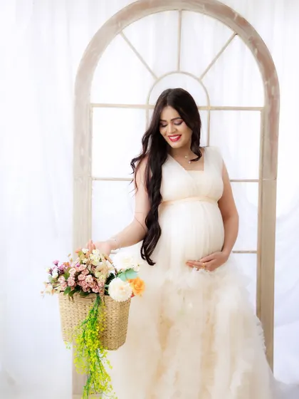 A duplicate of image 364, this light and airy portrait in a beautiful off-white gown is simply serene.