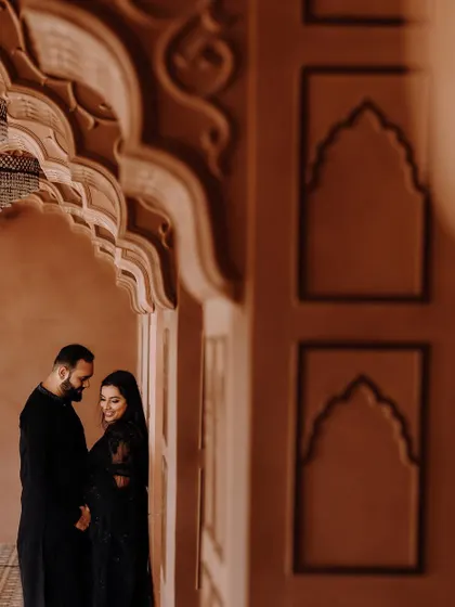 An artistic shot from their pre-wedding shoot, capturing a quiet moment between the couple.
