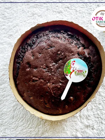 My classic Christmas plum cake, topped with a "Merry Christmas" pick. It's a simple, traditional, and delicious way to celebrate the season.