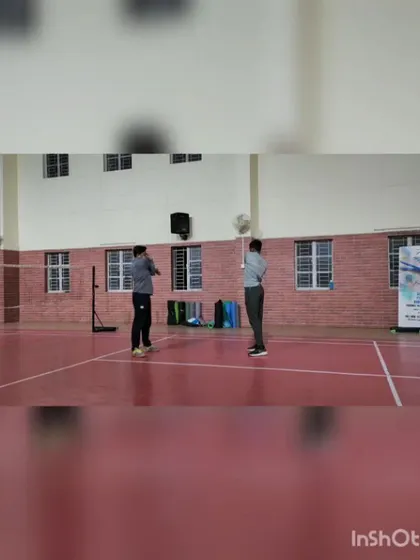 It's always rewarding to see players improve. This image captures a moment from a personal badminton coaching session, focusing on stance and ready position.