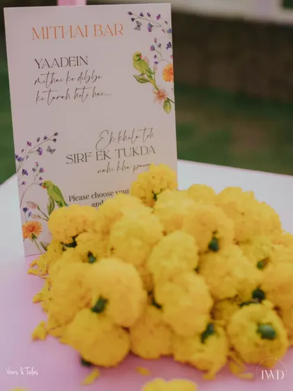 A cute sign at the Mithai Bar reads, "Yaadein mithai ke dibbe ki tarah hoti hain... Ek baar khula toh sirf ek tukda nahi kha paoge." (Memories are like a box of sweets... once you open it, you can't have just one piece).