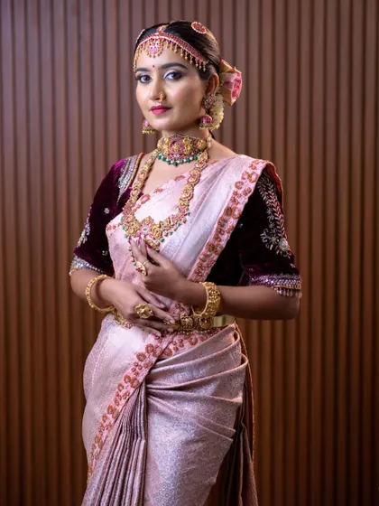The rich velvet blouse with delicate embroidery is a standout feature of this beautiful ensemble.