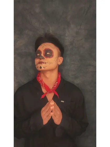 A straight-on view of the Coco-inspired makeup, showing the symmetry of the design. This is a popular request for themed events and Halloween.