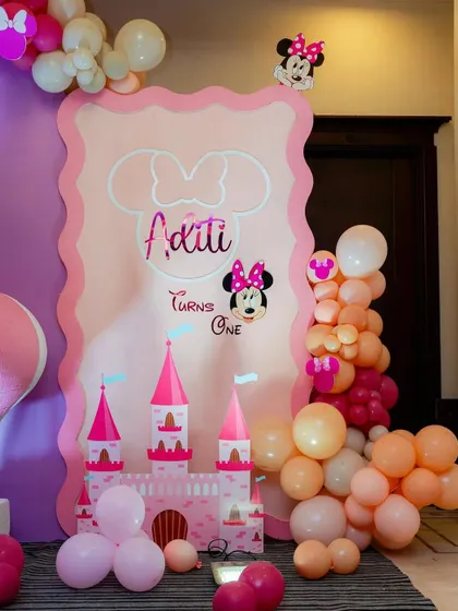 A personalized welcome sign for a Minnie Mouse themed first birthday. The design incorporates a castle and princess elements for a magical touch.