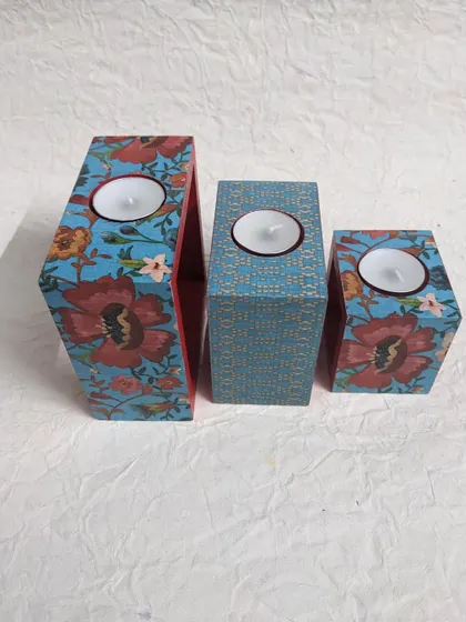 The full set of three candle holders with tea-lights, ready to create a warm and cozy atmosphere.