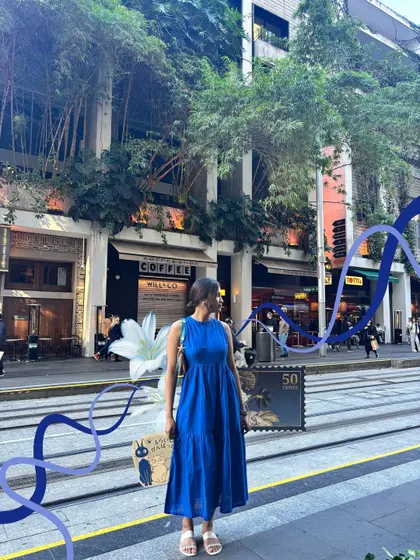 A simple walk down a Sydney street made more artistic with some abstract blue waves and a lily illustration.