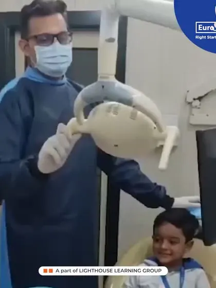 A brave student sits in the dentist's chair, learning about the tools used for a check-up. These visits help reduce anxiety and build confidence in our little ones.